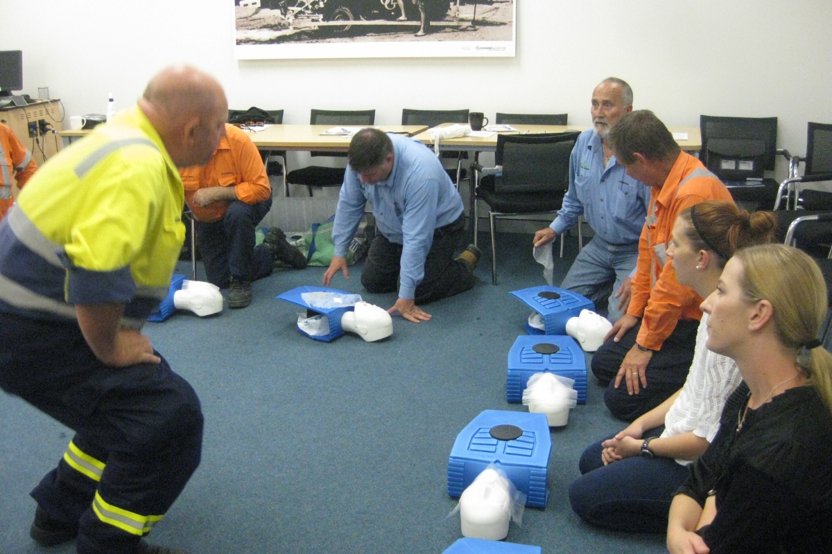 group of trainees learning CPR